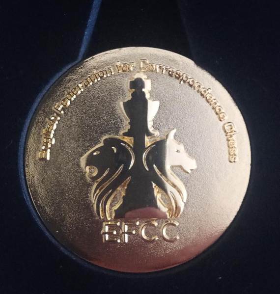 A gold medal with a lion and lion head

AI-generated content may be incorrect.