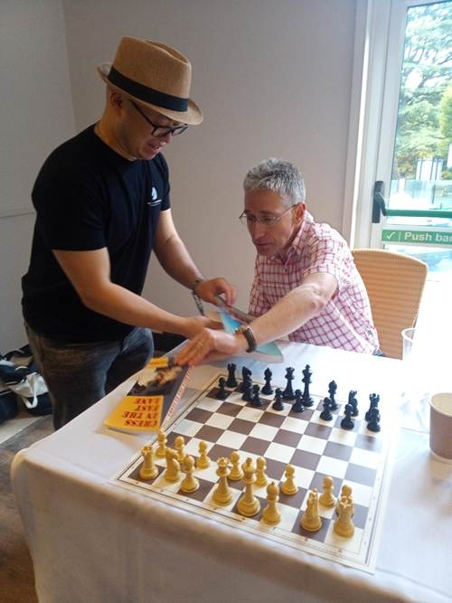 Two men playing chess

AI-generated content may be incorrect.